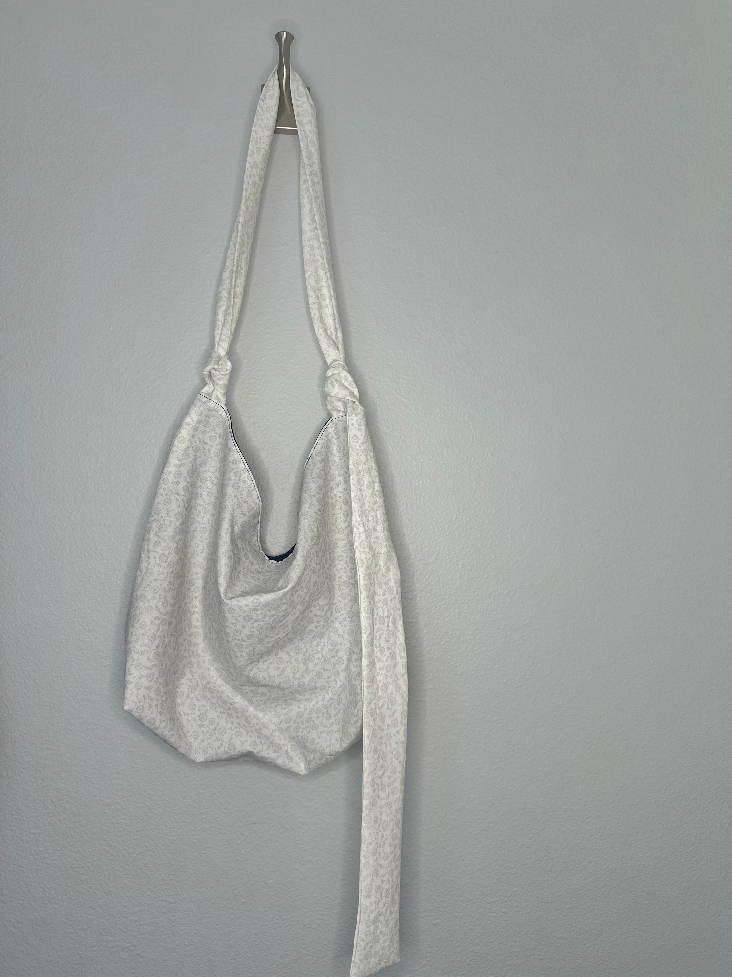 White Floral Slouchy Shoulder Bag with Adjustable Strap & Interior Pocket